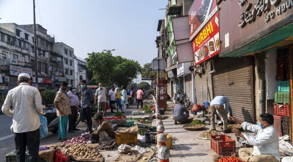 Bank officials wielding meghaphones tout for deposits on streets