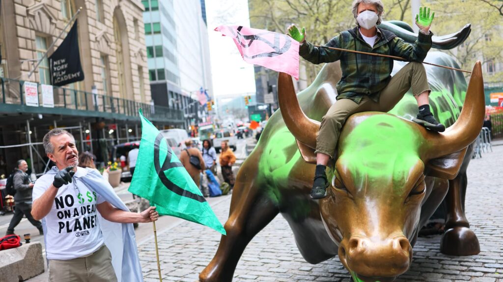 Wall Street's iconic charging bull statue vandalized by climate activists