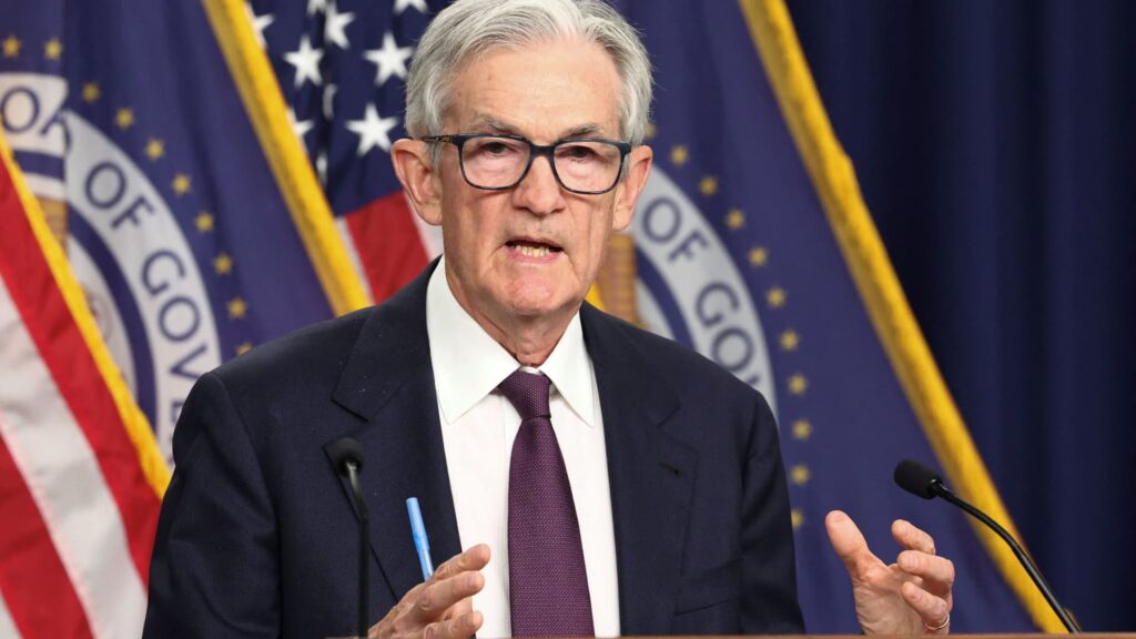 Fed leaves rates unchanged, defying Trump's demands for aggressive cuts