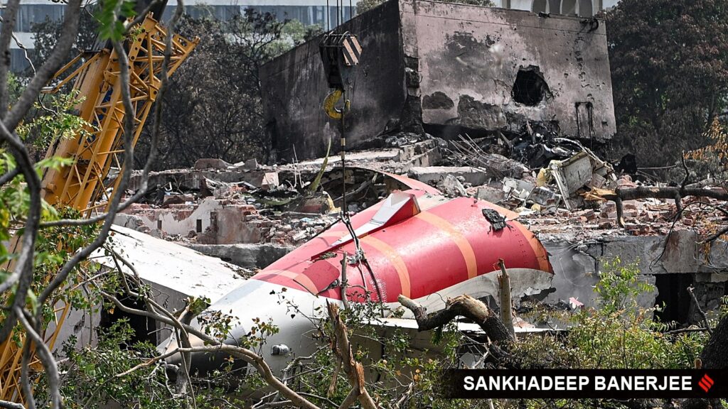 The debris of the crashed Air India flight being removed