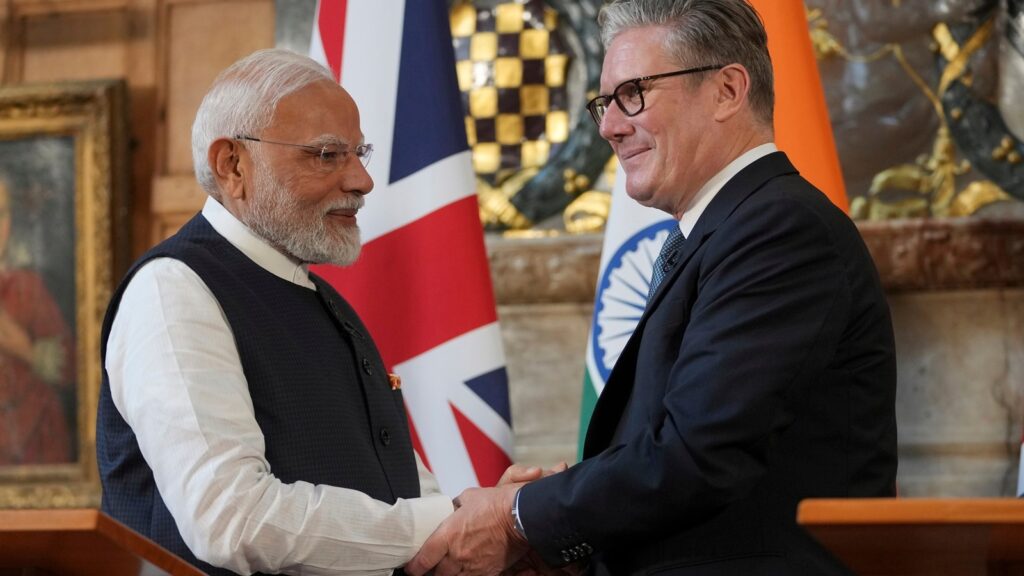 India-UK FTA: UK Prime Minister Keir Starmer and Prime Minister Narendra Modi of India shake hands after signing the free trade agreement on Thursday