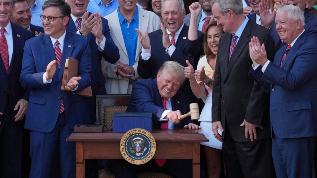 President Donald Trump bangs a gavel presented to him by House Speaker Mike Johnson of La., after he signed his signature bill of tax breaks and spending cuts at the White House