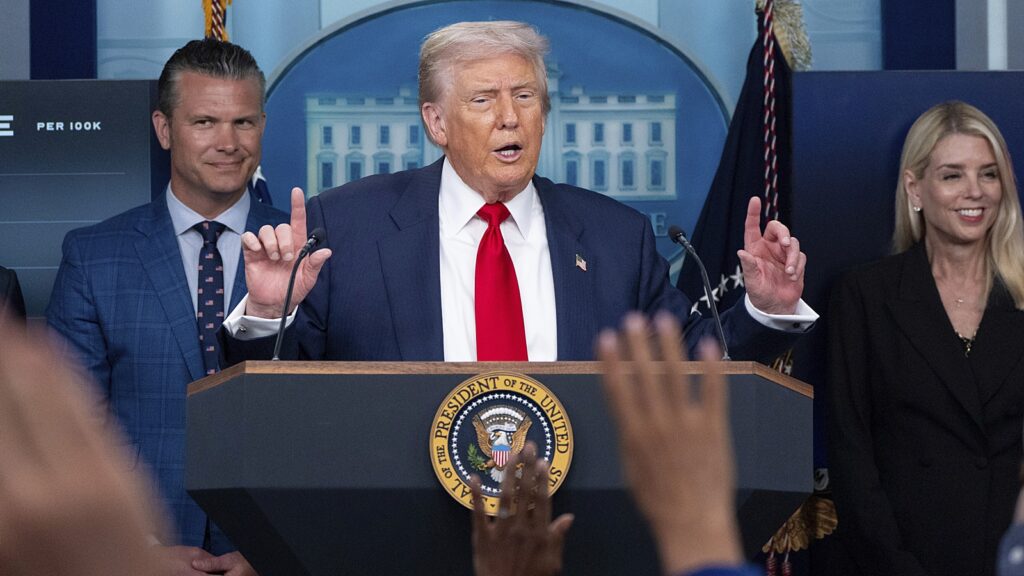 US President Donald Trump speaks with reporters at the White House