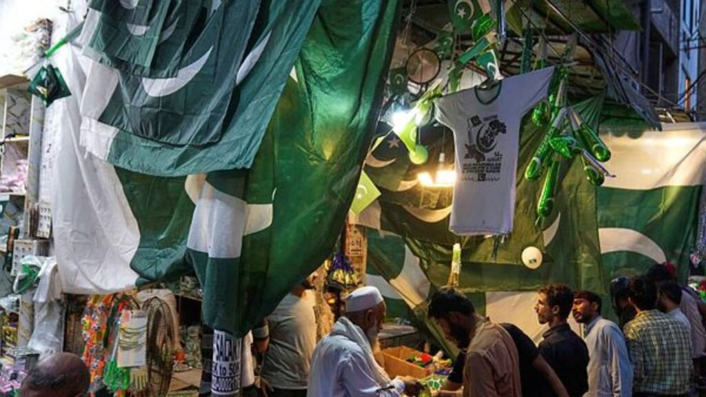 After Fitch and S&P, Moody’s upgrades Pakistan’s credit rating, but flags ‘fragile’ external position | Business News People shop for national flags and other items at a market in Lahore, Pakistan, Tuesday, Aug. 12, 2025, ahead of Independence Day celebrations. (AP Photo/K.M. Chaudary)