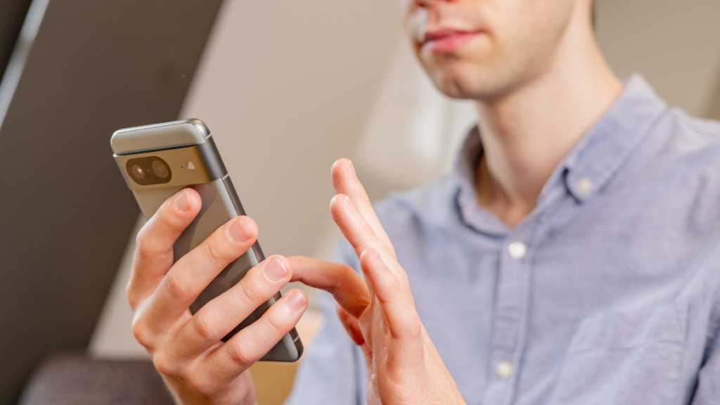 7 Brilliant Free Apps That You May Be Missing Out On A man using the Google Pixel 8 smartphone