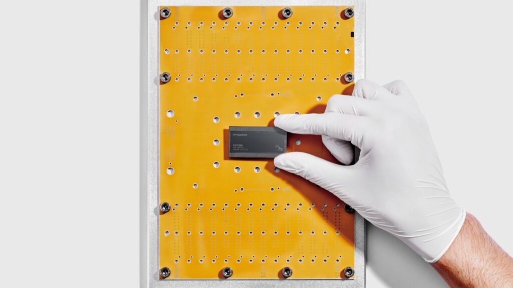 IBM researcher holds IBM Quantum Nighthawk chip