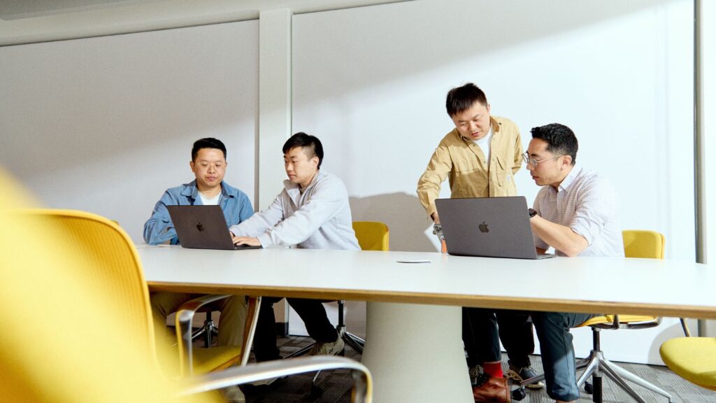 Coral’s founders, from right, John Kim, Quinn Leng and Ashton Teng with Neo Zhu, a marketing intern, in their office in Menlo Park, Calif., March 11, 2026